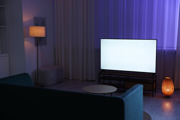 Wall Mural - Big modern tv in stylish living room at evening