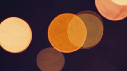 Aufkleber - Bokeh lights with soft orange glow on dark background, abstract photography concept