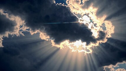 Poster - Sunlight breaking through dark storm clouds, dramatic sky. Nature and weather phenomenon concept