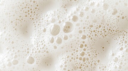 Poster - Soft, thick layers of creamy foam create a textured landscape with a myriad of tiny air bubbles glistening in the light. This captivating scene showcases the allure of cleanliness and freshness