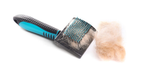 Wall Mural - Grooming brush and pile of pet's hair isolated on white