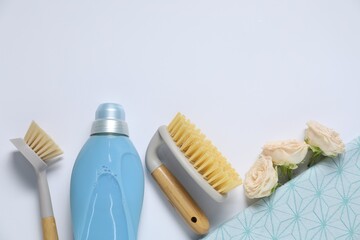 Wall Mural - Spring cleaning. Detergent, supplies and flowers on white background, flat lay. Space for text