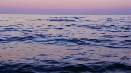 Poster - Calm ocean waves at sunset with colorful sky, tranquil and serene nature concept