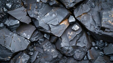 Poster - The close up view reveals dark mineral formations that exhibit sharp edges and cracked surfaces, highlighting the natural beauty and complexity of the geological landscape in a mining area.