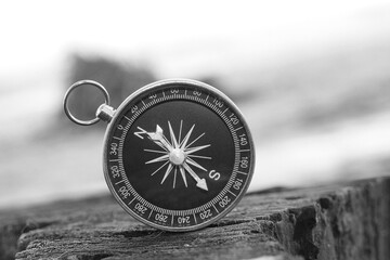 classic navigation compass on natural background