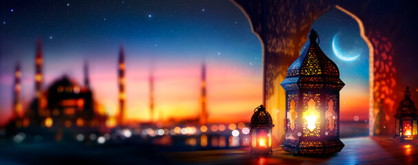 Wall Mural - ramadan kareem - arabic lantern with crescent moon - defocused mosque on background at sunset with b