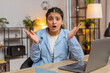 © Andrii Iemelianenko - Portrait of stress offended woman boring dissatisfied looking at camera shake head no rejection deny. Indian girl bored with work home office student stressful sad upset annoyed grimace. Lifestyle.