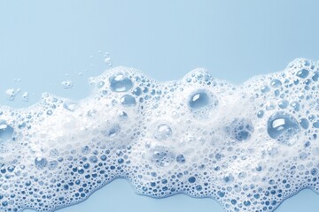 Poster - White soap foam creates a mesmerizing pattern of bubbles against a tranquil blue background, evoking a sense of calm and cleanliness. The texture invites exploration and curiosity
