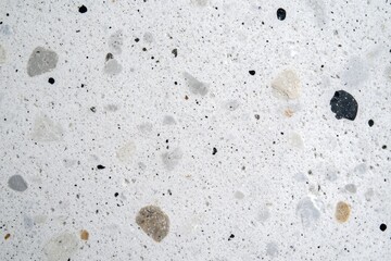 Wall Mural - White background with black and white rocks scattered across it