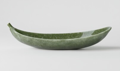 Wall Mural - Elegant green ceramic bowl shaped like a banana, displayed on a clean white background