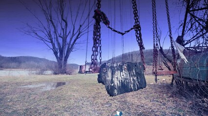 Wall Mural - old abandoned swing wind and fog 4k features an old swing swaying in the wind in an abandoned amusem