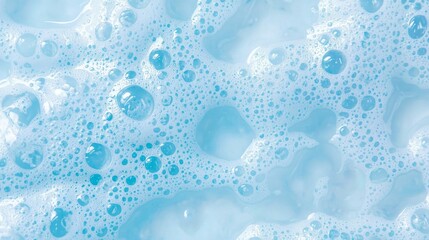 Poster - Soft, vibrant blue foam creates a mesmerizing pattern of bubbles, reflecting light in a tranquil atmosphere. Ideal for highlighting the beauty of everyday cleansing products and their textures