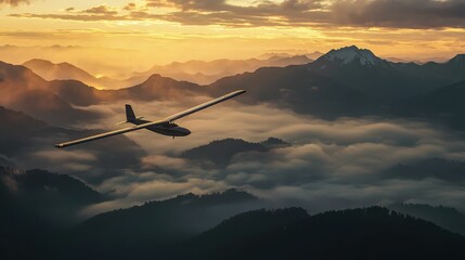 Wall Mural - Graceful Glider Aircraft Drifting Over Misty Mountain Landscape