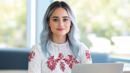 Wall Mural - Blue hair business woman in white dress with embroidery working with a laptop