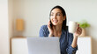 © Prostock-studio - Business Communication. Cheerful Businesswoman Talking On Cellphone Sitting At Laptop In Office And Having Coffee. Selective Focus