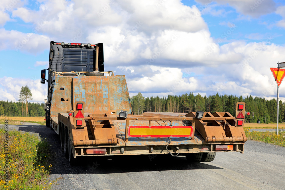 Pull Low Load Heavy Truck Pulling Low Loader Trailer Makes Right Turn, Rear View ...