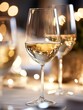 © The Little Hut - Elegant white wine in a crystal glass setting with bokeh lights creating a festive atmosphere : Generative AI
