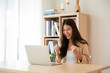 © Monster Ztudio - Happy euphoric young asian woman celebrating winning or getting ecommerce shopping offer on computer laptop. Excited happy girl winner looking at notebook celebrating success