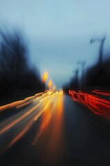 Poster - abstract dynamic motion blur of colorful car lights on a city street at night creating vibrant energy : Generative AI