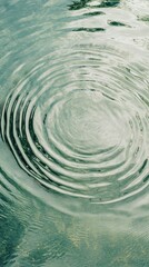 Poster - Gentle ripples cascade across the surface of light green water, creating a calming visual melody. Shadows play softly as nature breathes in harmony with the moment