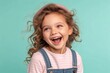 © NaparatAI - a happy little girl with curly hair, joyfully laughing with a cheerful and playful expression. The girl is wearing a cute headband