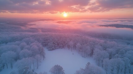 Poster - aerial view of the sun setting over the clouds creating a colorful,dramatic sky