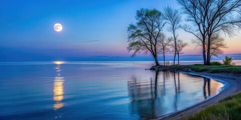 Wall Mural - Silvery light of moonrise reflects on Lake Michigan's calm surface creating a serene and peaceful atmosphere at dusk with silhouetted trees in the foreground, nightfall landscape, evening scene