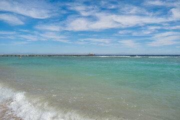 Wall Mural - Beautiful turquoise waters and serene beach setting in Egypt under a vibrant sky