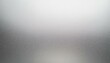 bright grainy metallic silver gradient aluminum texture abstract blurry monochrome frosted glass effect background 