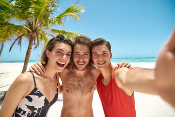 Sun-Kissed Memories: Friends Taking a Selfie on a Tropical Beach