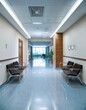 © Rahmat  - Hospital corridor with chairs and reception