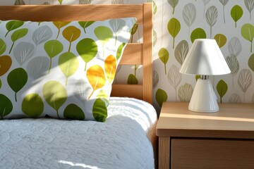 Poster - Serene bedroom scene with leaf patterned pillow lamp and wallpaper creating a cozy and inviting atmosphere capturing the essence of home decor