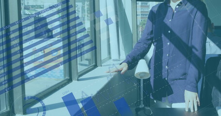Poster - Image of financial data processing over caucasian businesswoman looking through window in office