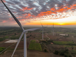 Wall Mural - Wind farm field and sunset sky. Wind power. Sustainable, renewable energy. Wind turbines generate electricity. Sustainable development. Green technology for energy sustainability. Eco-friendly energy.