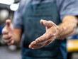 © Nakarin - Mechanic gesturing with hands while discussing vehicle repair