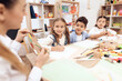 © Oleh Veres - Children have a drawing lesson at school.