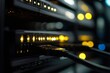 © BerkahStock - Close-up of server rack with illuminated lights and cables connected, showcasing data center technology.