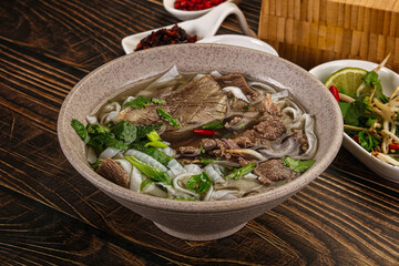 Wall Mural - Vietnamese Pho Bo soup with beef and noodles