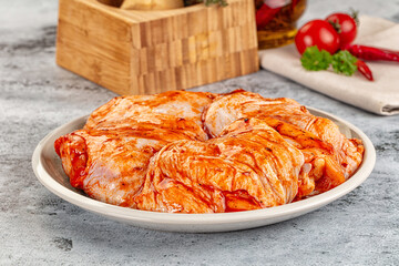 Wall Mural - Raw chicken marinated thighs with skin