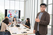 © PhugunStock - Asian male businessman standing with thumbs up looking at camera, businessman brainstorming, discussing analysis, innovation, collaboration. online business Sales techniques and strategic planning