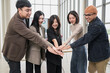 © PhugunStock - Asian business men and women join forces to check hands happily. Brainstorm and talk about analytics, innovation, and collaboration. online business Modern sales techniques and strategic planning