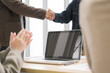 © PhugunStock - Happy Asian business men holding hands, brainstorming, talking about analysis, innovation and collaboration. Online business, sales techniques, strategic planning
