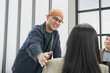 © PhugunStock - Asian male businessman sends encouragement to friend Join the meeting happily, brainstorm and talk about analysis, innovation, and collaboration. online business Sales techniques strategic planning