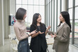 © PhugunStock - Asian business woman Stand and talk, brainstorm ideas, talk about analysis, innovation, and collaboration. Online business, sales techniques, modern strategic planning