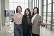 © PhugunStock - Asian businesswoman poses, looks into the camera, brainstorms and talks about analytics, innovation and collaboration. Online business, sales techniques, modern strategic planning