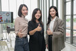 © PhugunStock - Asian business woman Thumbs up, looks into the camera, brainstorms and talks about analysis, innovation, and collaboration. Online business, sales techniques, modern strategic planning