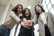 © PhugunStock - Asian business woman Join forces with friends, look into the camera, brainstorm and talk about analysis, innovation, and collaboration. Online business, sales techniques, modern strategic planning