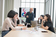 © PhugunStock - Businessman, Asian man and woman The meeting was tense. Brainstorm and talk about analysis, innovation, and collaboration. online business Modern sales techniques and strategic planning