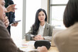 © PhugunStock - Asian businesswomen sit in a tense meeting and brainstorm, discussing analysis, innovation, collaboration. online business Modern sales techniques and strategic planning