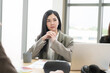 © PhugunStock - Asian businesswomen sit in a tense meeting and brainstorm, discussing analysis, innovation, collaboration. online business Modern sales techniques and strategic planning